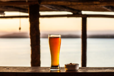 Close-up of beer glass on table