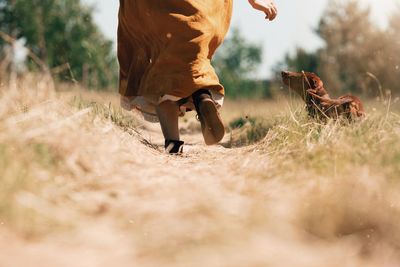 Full length of women on field