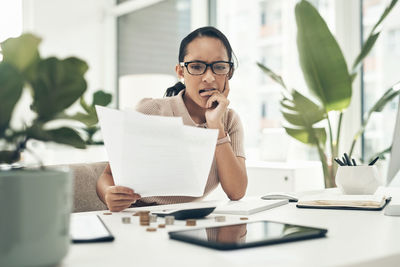 Businesswoman working at desk in office