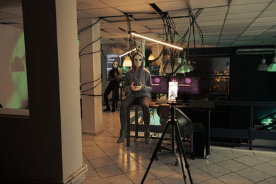 Rear view of man standing in restaurant