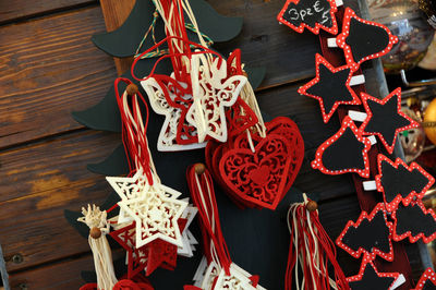 Close-up of christmas decorations hanging at market stall