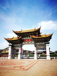 Temple against cloudy sky