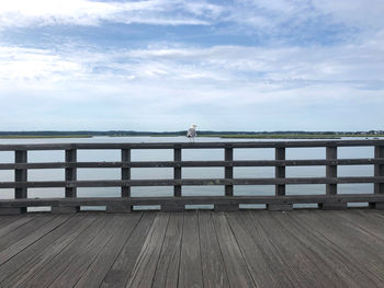 Pier over sea against sky