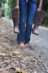 Low section of man standing on ground