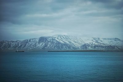 Scenic view of snow covered mountains