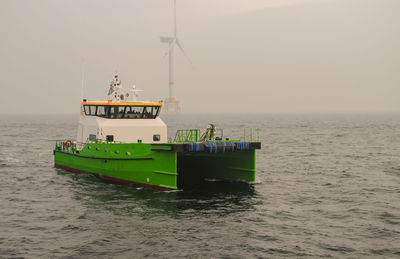 Boat in sea against sky