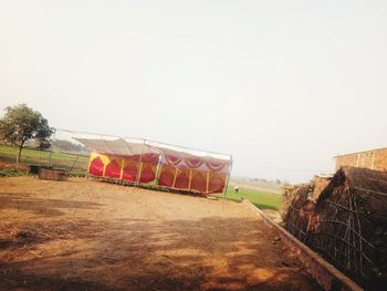 Built structure on field against clear sky