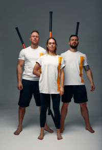 Rear view of people standing against white background