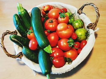 High angle view of squash and tomatoes in basket