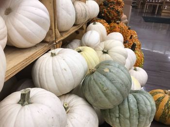 Stack of pumpkins for sale at market stall