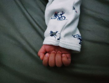 Close-up of man holding hands