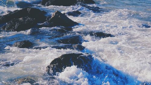 Waves splashing on rocks