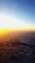 Aerial view of landscape against sky during sunset