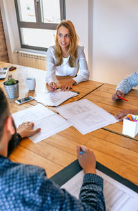 High angle view of woman working at desk in office
