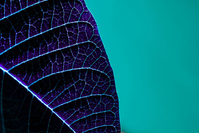 Low angle view of illuminated building against blue sky
