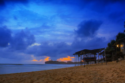 Scenic view of beach against sky during sunset
