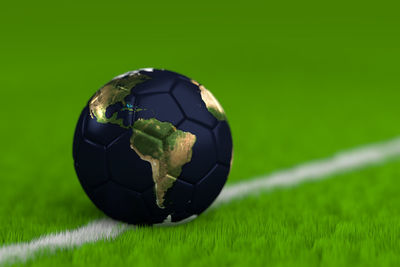 Close-up of ball on soccer field