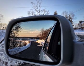 Reflection of road on side-view mirror