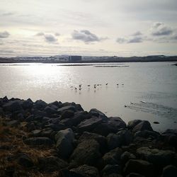 Scenic view of sea against cloudy sky