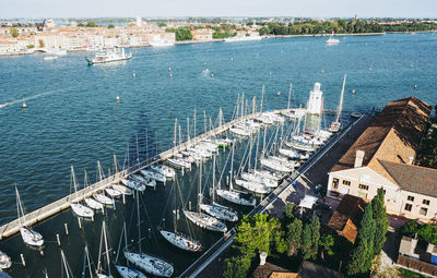 High angle view of boats moored at harbor