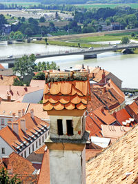 Houses in town against bridge over river