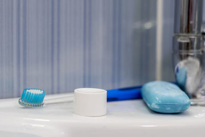 Close-up of toothbrush and soap in bathroom