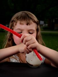 Portrait of girl holding ice cream