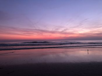 Scenic view of beach against sky during sunset