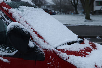 Close-up of snow covered car