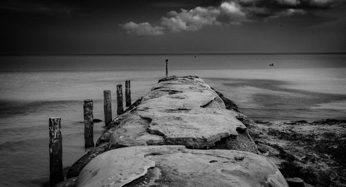 Pier over sea against sky