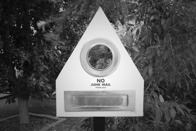 Close-up of mailbox against trees