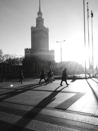Full length of people walking in city