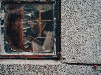 Close-up of old window of abandoned building