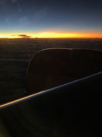 Scenic view of sunset seen through airplane window