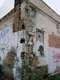 Close-up of graffiti on brick wall