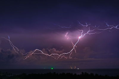 Scenic view of lightning in sky at night