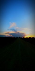 Scenic view of road against sky during sunset