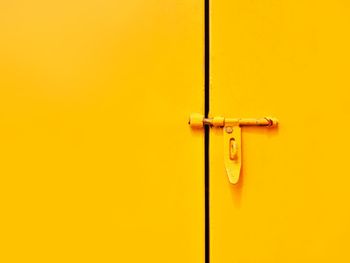 Close-up of yellow door