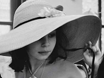 Close-up of woman wearing hat