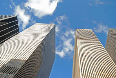 Low angle view of modern buildings against sky in city