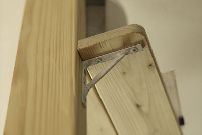 Close-up of wood against wall at home