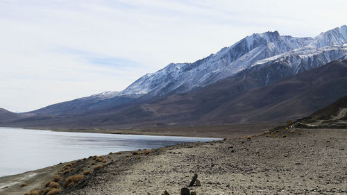 Scenic view of snowcapped mountains against sky