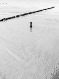 High angle view of wooden post on beach