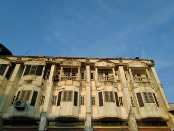Low angle view of building against blue sky