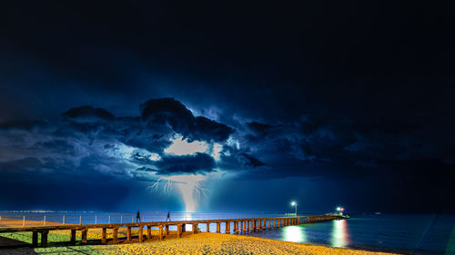 An almost apocalyptic scene of  a lightning storm with lightning hitting the sea 