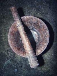 High angle view of rusty metal on wood