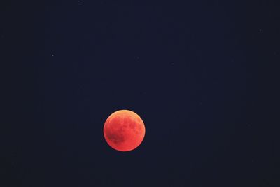 Idyllic shot of full moon against clear sky at night