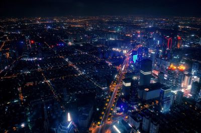 High angle view of illuminated cityscape at night