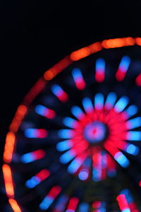 Close-up of illuminated ferris wheel