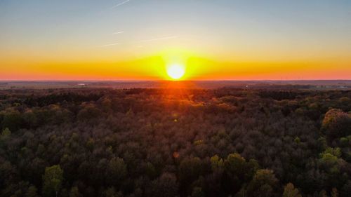 Scenic view of landscape against sky during sunset